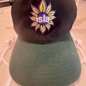 Vintage Black and Green Cap with Sunflower Logo from Isla Surf Shop in SPI, TX.